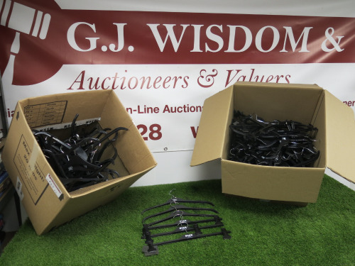 2 x Boxes of Black Plastic Hangers.