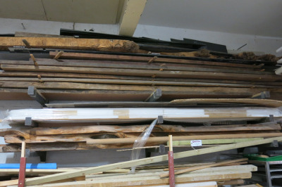 Shelf Containing 13 x Lengths of Assorted Sized Timber. Size Approx L3-4M x W50cm x Thickness 4-6cm.