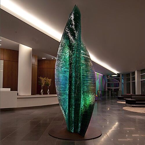 Danny Lane Glass Sculpture "Six is Nine" Glass Statement Piece in 12mm Hammer Chipped Glass. Size Height 250cm x Width 112.5cm. NOTE: Sculpture is unassembled and located on stillages in a storage location in Suffolk. Danny Lane has agreed to assist in ha