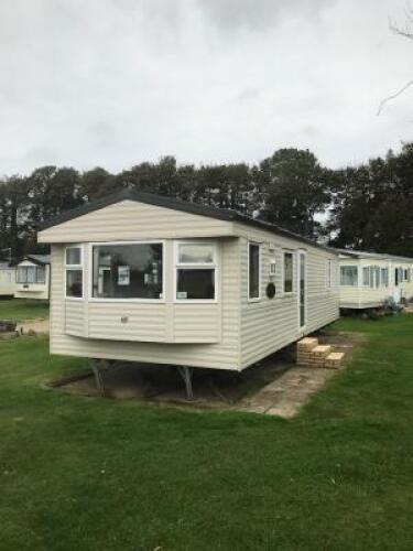 Willerby Richmond 2 Bedroom/4 Berth Double Glazed Static Caravan. Year 2006, S/N WB2018-8, Size 33' x 12'. Layout Includes Open Kitchen, Diner & Living Room, 1 x Double Bedroom, 1 x Twin Bedroom & Bathroom. Contents to Include: 2 Seater Cream Leather Sofa
