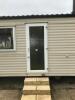 Willerby Richmond 2 Bedroom/4 Berth Double Glazed Static Caravan. Year 2006, S/N WB2018-8, Size 33' x 12'. Layout Includes Open Kitchen, Diner & Living Room, 1 x Double Bedroom, 1 x Twin Bedroom & Bathroom. Contents to Include: 2 Seater Cream Leather Sofa - 6