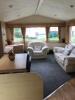 Willerby Richmond 2 Bedroom/4 Berth Double Glazed Static Caravan. Year 2006, S/N WB2018-8, Size 33' x 12'. Layout Includes Open Kitchen, Diner & Living Room, 1 x Double Bedroom, 1 x Twin Bedroom & Bathroom. Contents to Include: 2 Seater Cream Leather Sofa - 7