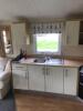 Willerby Richmond 2 Bedroom/4 Berth Double Glazed Static Caravan. Year 2006, S/N WB2018-8, Size 33' x 12'. Layout Includes Open Kitchen, Diner & Living Room, 1 x Double Bedroom, 1 x Twin Bedroom & Bathroom. Contents to Include: 2 Seater Cream Leather Sofa - 8