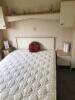 Willerby Richmond 2 Bedroom/4 Berth Double Glazed Static Caravan. Year 2006, S/N WB2018-8, Size 33' x 12'. Layout Includes Open Kitchen, Diner & Living Room, 1 x Double Bedroom, 1 x Twin Bedroom & Bathroom. Contents to Include: 2 Seater Cream Leather Sofa - 11