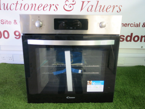 Candy 2200W Stainless Steel Integrated Electric Single Oven, Mod FIDCX405, S/N 3370347922380023. Comes with Rack Supports, 1 x Tray & User Manual.