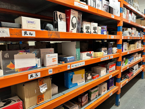 14 x Shelves of Assorted Smart & General Electricals to Include: PC & Laptop Headsets, Webcams, Meters, Readers, Monitors, Amp, Chargers, Testers, Fire Alarms, Door Bells, Lights, Plugs, Phones, Dash Cam Recorder, Radio, DVD Player, Wi-Fi Power Sockets, G