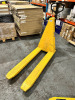 1000kg Electric Powered Pallet Truck in Yellow. NOTE: requires repair, oil leaking.