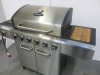 Outback BBQ, Model Meteor Plus 6S Gas/Charcoal Hybrid BBQ. Comes with 3 x Bags of Outback Coconut Shell Brickets. - 3