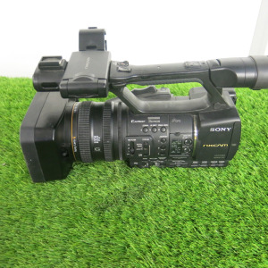 Sony NXCAM Digital HD Camera Recorder, Model HXR-NX5E, S/N 215307, Sony Lens G 1.6/4.1-82, 20 x Optical Zoom. Comes with 1 x Sony NP-F970 Battery, Sony AC Adaptor/Charger AC-VL1 & Ultimax Camera Bag.