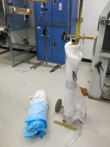 Yellow Trolley with 2 x Rolls of Plastic Cover.
