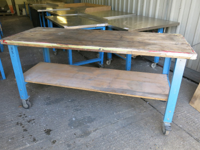 Mobile Height Adjustable Metal Framed Wood Top Workshop Table in Blue with Shelf Under. Size W200 x D76cm.