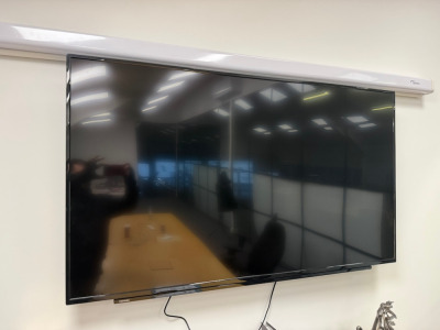 Toshiba 58" TV with Remote on Wall Bracket.