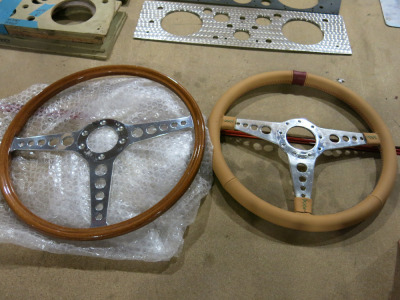2 x Steering Wheels, 1 x Leather, 1 x Wood Rim.