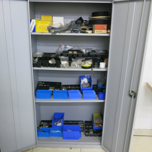Active 2 Door Upright Cabinet of Upholstery Accessories to Include: Nails, Screws, Press Studs, Poppers, Staples, Strapping, Belt Buckles, Push On Fixings Etc (As Viewed).