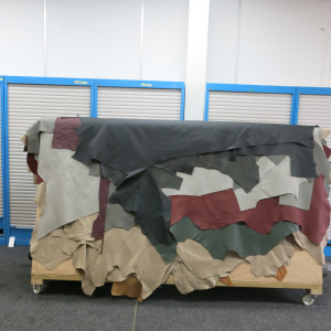 Approx 25 x Full & Part Hides in Soft Leather in Assortment of Colours from Grey, Black, Tan, Red, Green On Mobile Wooden A Frame (As Viewed).