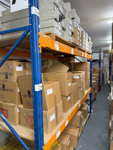 Approx 30 Bays or Boltless Racking in Orange & Blue to Include: 34 x Uprights (260cm x 90cm), 88 x Crossbeams (270cm) & 44 x Assorted Wood & Slate Shelves. NOTE: located London, E9, buyer to view & collect by appointment only and supply sufficient labour 