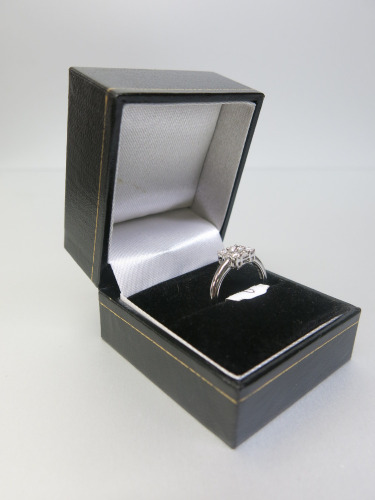 18ct White Gold, Diamond Ring with Round Centre & 4 x Corner Stones with 4 x Baguettes to Sides (0.44ct) in Box. Ring Size L. RRP &pound;2100.