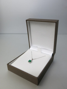 18ct White Gold 16" Curb Chain, 0.67ct Emerald & Diamond Surround Pendant. RRP &pound;595.