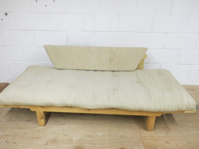 Futon Sofa Bed in Light Wood with Cushions.