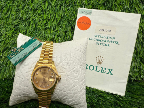 Rolex Datejust 18ct Gold Ladies Wrist Watch, 26mm Gold and Diamond Dial. Model 69178, Year 1988. Comes with Original Papers, Bracelet is Believed to be Aftermarket. NOTE: no original box available with this watch and we have had verified as original Ro