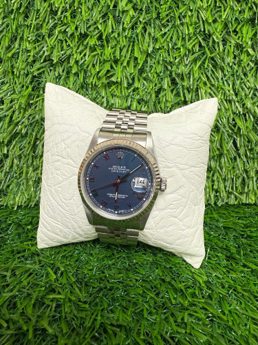 Rolex Datejust Stainless Steel Wrist Watch, 36mm Blue Roman Dial, Model 16234, Year 1993. Bracelet is Advised to be Aftermarket. NOTE: no original box or papers available with this watch and we have had verified as original Rolex, other than aftermarke