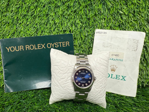 Rolex Oyster Perpetual Stainless Steel Wrist Watch, 31mm Blue & Diamond Dial, Model 67480, Year 1997. Comes with Original Certificate & Rolex Oyster Pamphlet. NOTE: no original box available with this watch and we have had verified as original Rolex, h