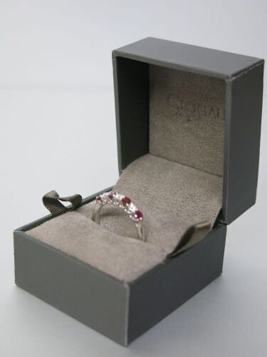 9ct White Gold Ring with 4 Ruby's (0.40) & 3 Diamonds (0.23). Size M-N. RRP &pound;1125.