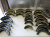 Crate Containing 16 x Pairs of Brake Shoes (As Viewed), 17 x Brake Drum Back Plates. NOTE: all appear to be for Jaguar models.