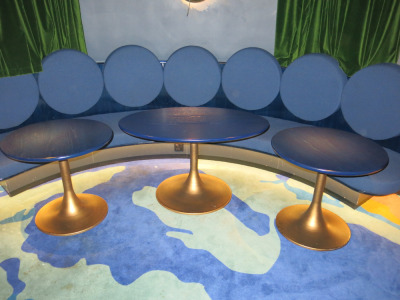 13 x Lounge Tables with Birch Plywood Tops Stained Blue with Burnished Brass Metal Tulip Pedestal Base to Include: 10 x Oval, Size H63 x W112 x D70cm & 3 x Round, Size H63 x Dia 70cm.