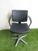 Professional Height Adjustable Barbers Chair on Chrome Base in Black PVC.