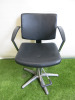 Professional Height Adjustable Barbers Chair on Chrome Base in Black PVC.