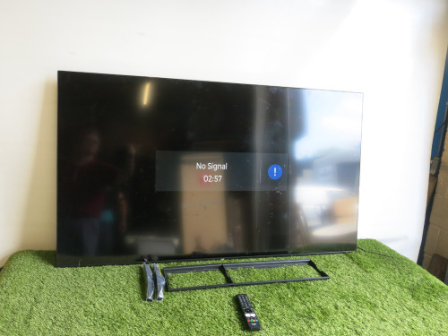 Bush 65" HDMI TV, Model 65UT24SB, S/N 29251435400075. Comes with Remote Control, Power Supply, Wall Bracket & 2 Legs.