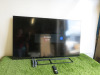 Bush 65" HDMI TV, Model 65UT24SB, S/N 29251435400075. Comes with Remote Control, Power Supply, Wall Bracket & 2 Legs.
