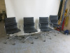 4 x Chrome Framed Black Stitched Faux Leather Swivel Chairs.