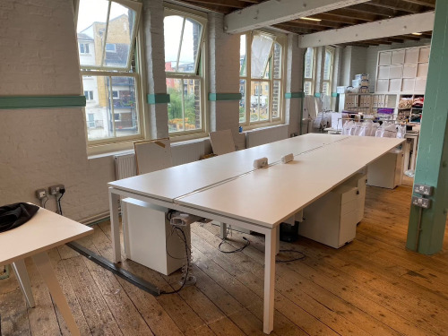 Lot Comprising of Assorted Task White Pod Furniture to Include: 3 Runs - 4.4m x 1.61m, 4.8m x 1.61m, 2.4m x 1.61m Double Sided with Computer Mounts Under. 1 x 1m x 2m High Table. 1 x 3m x 80cm (2 Section) Tabling with 20 x 3 Drawer Metal Pedestals. NOTE: 
