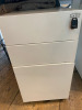 Lot Comprising of Assorted Task White Pod Furniture to Include: 3 Runs - 4.4m x 1.61m, 4.8m x 1.61m, 2.4m x 1.61m Double Sided with Computer Mounts Under. 1 x 1m x 2m High Table. 1 x 3m x 80cm (2 Section) Tabling with 20 x 3 Drawer Metal Pedestals. NOTE: - 4