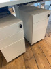 Lot Comprising of Assorted Task White Pod Furniture to Include: 3 Runs - 4.4m x 1.61m, 4.8m x 1.61m, 2.4m x 1.61m Double Sided with Computer Mounts Under. 1 x 1m x 2m High Table. 1 x 3m x 80cm (2 Section) Tabling with 20 x 3 Drawer Metal Pedestals. NOTE: - 5
