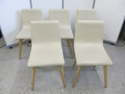 14 x Dining Chairs Upholstered in Cream Faux Leather On Wooden Frame Legs.