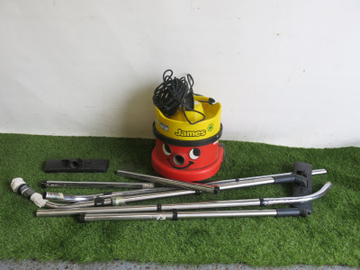 Numatic Vacuum Cleaner, Model JVP 180A. Comes with Assorted Lengths of Metal Pipe Work. NOTE: missing wheel & requires hose etc.