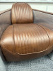 Timothy Oulton Aviator Tomcat Chairs in Brown Leather & Spitfire Design. Product Description from Website: Taking inspiration from the legendary British fighter plane, the innovative Aviator Tomcat is modelled on the twin cockpit chair of the American F-1 - 2