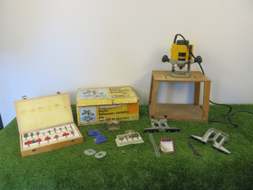 DeWalt Router, Model DW613 with Bench Jig, Freud Router Bit Set & Other Bits (As Viewed).