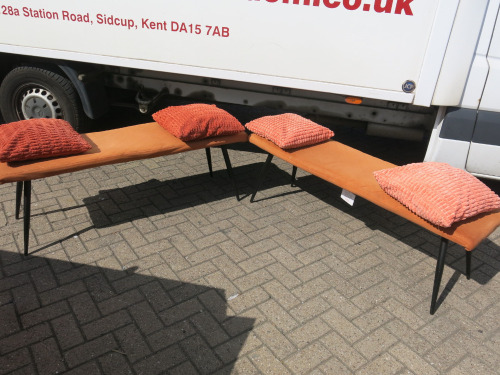 Pair of Benches Upholstered in Orange Quilted Fabric with Black Wooden Legs, Size H48 x W140 x D42cm. Comes with 4 x Orange Cushions.