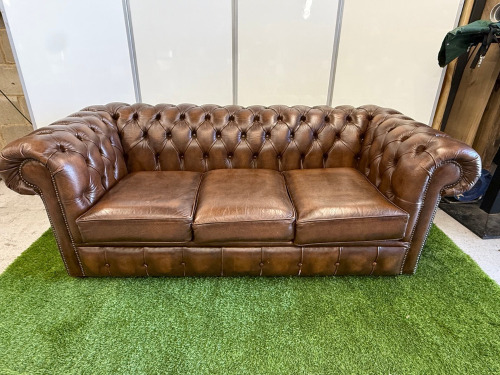 Dark Brown Leather Chesterfield Sofa with Short Wooden Leg Stumps. Size H74cm, W194cm & D90cm.