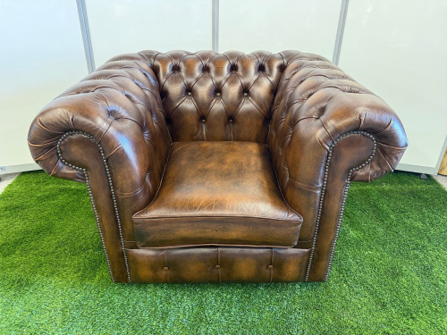 Dark Brown Leather Chesterfield Armchair with Short Wooden Leg Stumps. Size H74cm, W108cm &D88cm.
