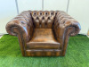 Dark Brown Leather Chesterfield Armchair with Short Wooden Leg Stumps. Size H74cm, W108cm &D88cm.
