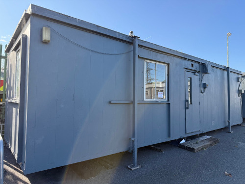 9.8m x 3m Jackleg Cabin with Surround Seating. NOTE: removal by appointment at end of clearance (Condition As Viewed & Inspected).