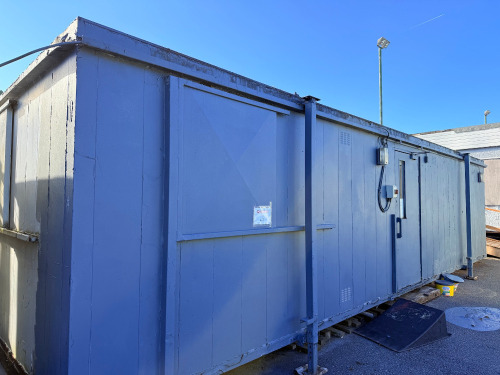 9.8m x 3m Jackleg Cabin with Seating & Lockers. NOTE: removal by appointment at end of clearance (Condition As Viewed & Inspected).