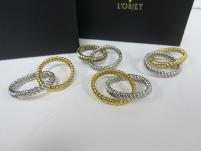 4 x L'OBJET Silver and Gold Napkin Rings, with Original Box.