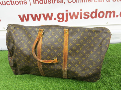 Louis Vuitton Brown Monogram Keepall Bandouliere 55 Duffle Bag. Size H40cm, W55cm & D25cm. NOTE: broken handle and worn, condition as viewed/inspected.