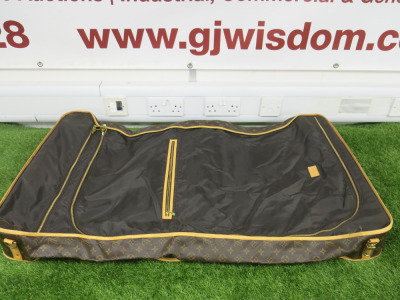Louis Vuitton Brown Monogram Travel, Garment, Suit Bag. Size H106cm, W60cm & D12cm. NOTE: missing hanger and strap, condition as viewed/inspected.